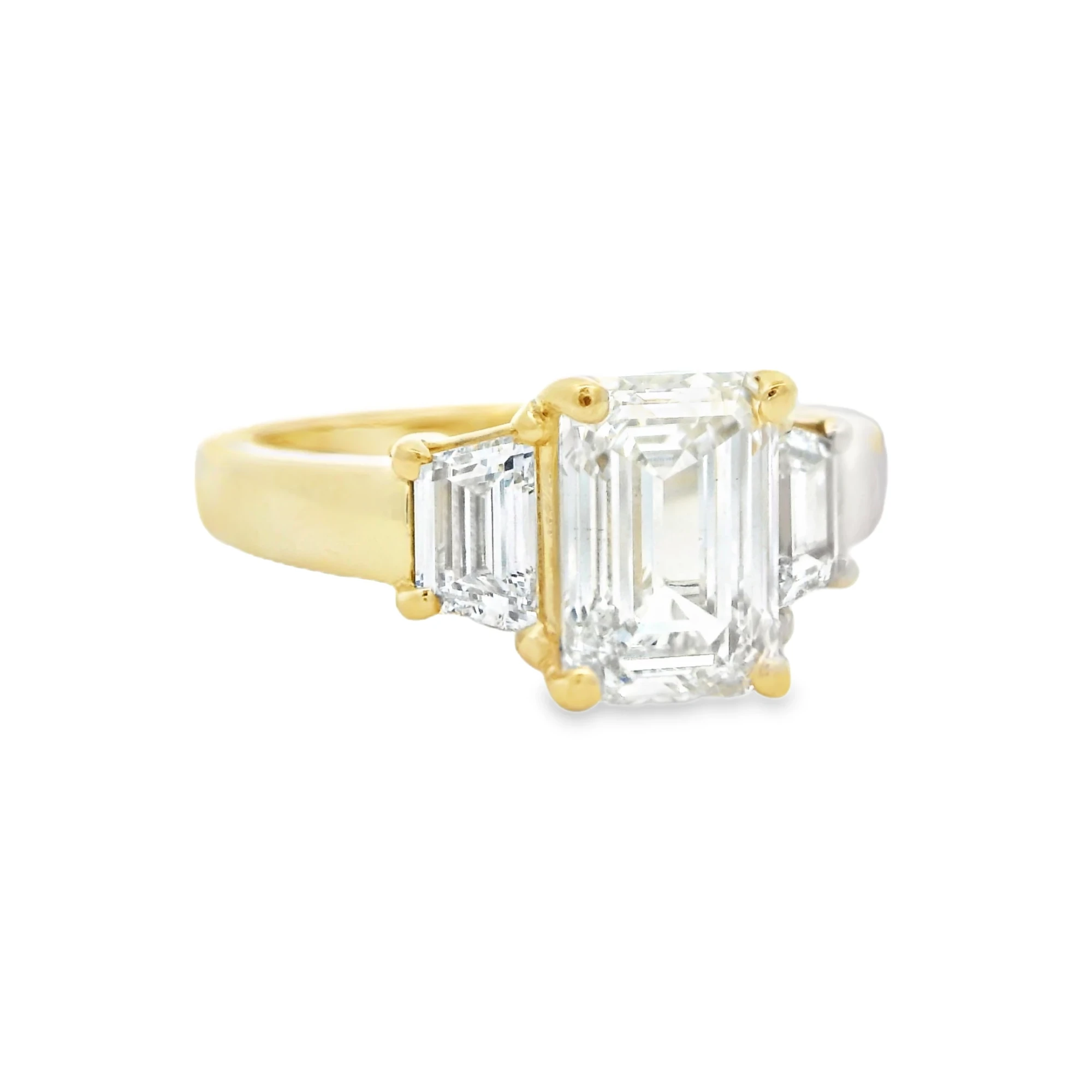 Emerald and Trapezoid Three-Stone Ring