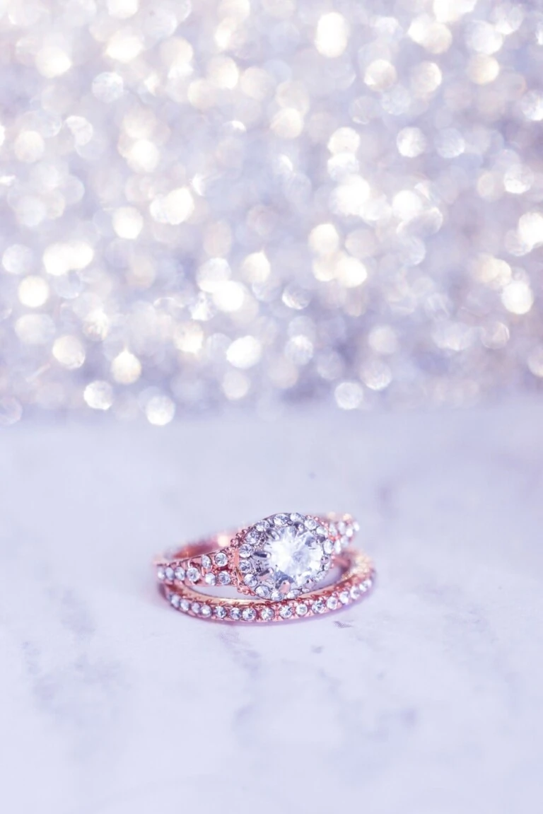 Lab-grown diamond engagement ring resting on a marble surface