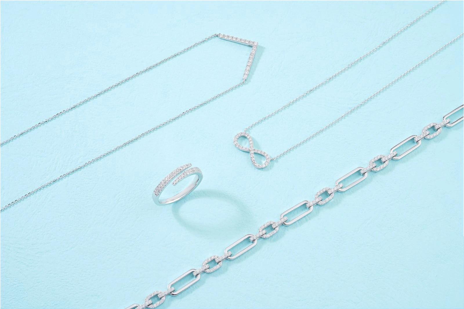 Lab-grown diamond and platinum jewelry set including a ring and earrings